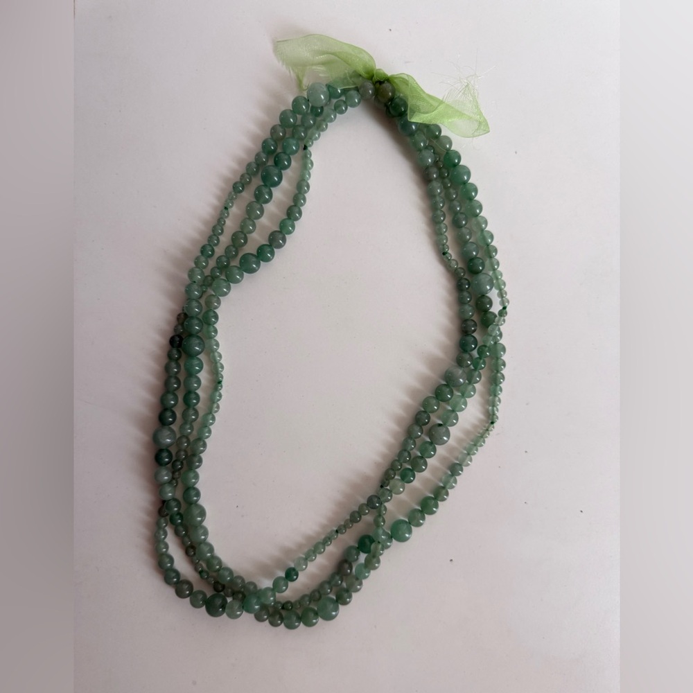 Triple-strand green glass bead necklace